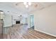 View of the open concept living room featuring a fireplace and wood-look flooring at 5666 Goldfield Dr, Acworth, GA 30102