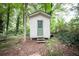 Exterior view of a charming storage shed with a green door and stairs at 5666 Goldfield Dr, Acworth, GA 30102