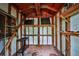 Inside of a storage shed with wooden beams, shelving, and a simple workbench at 5666 Goldfield Dr, Acworth, GA 30102