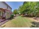Large, fenced backyard with a patio, swing set, and plenty of space for outdoor activities at 1370 Stoney Field Place, Lawrenceville, GA 30043