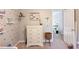 Well-organized Bedroom with a dresser, decorative shelves, and charming accents at 1370 Stoney Field Place, Lawrenceville, GA 30043