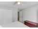 Light-filled bedroom offering closet space and neutral carpeting at 1370 Stoney Field Place, Lawrenceville, GA 30043