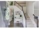Inviting foyer with staircase, hardwood floors, and elegant decor welcomes you into this beautiful home at 1370 Stoney Field Place, Lawrenceville, GA 30043