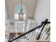 Elegant foyer features a hanging chandelier, large window, and staircase at 1370 Stoney Field Place, Lawrenceville, GA 30043