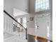 Elegant foyer with soaring ceilings, hardwood floors, and an abundance of natural light creates a grand entrance at 1370 Stoney Field Place, Lawrenceville, GA 30043