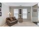 Comfortable living room with plush seating, ample lighting, and serene decor offers a relaxing ambiance at 1370 Stoney Field Place, Lawrenceville, GA 30043