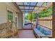 Inviting covered patio with stylish seating and a view of the lush backyard at 1370 Stoney Field Place, Lawrenceville, GA 30043
