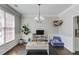 Bright and cheerful playroom with hardwood floors, toy storage, and ample space for creative activities at 1370 Stoney Field Place, Lawrenceville, GA 30043