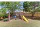 Fun backyard swing set with a slide, swings, and a seesaw for to enjoy at 1370 Stoney Field Place, Lawrenceville, GA 30043