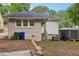 Exterior view of the home showing the backyard, entrance, and storage shed at 1667 Sylvan Sw Rd, Atlanta, GA 30310