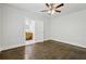 Bedroom featuring hardwood floors, neutral walls, and connected bathroom at 1667 Sylvan Sw Rd, Atlanta, GA 30310