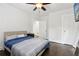 Bedroom with hardwood floors, ceiling fan, neutral walls, and stylish furnishings at 1667 Sylvan Sw Rd, Atlanta, GA 30310