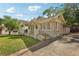 Well-maintained home featuring a brick facade, a covered porch and driveway at 1667 Sylvan Sw Rd, Atlanta, GA 30310