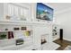 Cozy fireplace with built-in shelves, modern decor, and hardwood floors at 1667 Sylvan Sw Rd, Atlanta, GA 30310