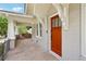 Welcoming front porch with sitting area and brick facade leading to front door at 1667 Sylvan Sw Rd, Atlanta, GA 30310