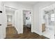 Hallway with hardwood floors leading to rooms with bathroom, living room, and back entrance at 1667 Sylvan Sw Rd, Atlanta, GA 30310