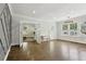 Open living room features hardwood floors, french doors, and bright windows at 1667 Sylvan Sw Rd, Atlanta, GA 30310