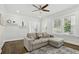 Inviting living room featuring modern furniture, a gray rug, and hardwood floors at 1667 Sylvan Sw Rd, Atlanta, GA 30310