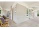 Covered porch featuring a charming swing, brick walls and neutral color palette at 1667 Sylvan Sw Rd, Atlanta, GA 30310