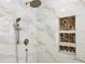 Beautiful walk-in shower features a rainfall shower head and stylish mosaic tile shelving at 1667 Sylvan Sw Rd, Atlanta, GA 30310