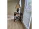 A side table sits adjacent to a window with blinds and neutral toned carpet at 2859 Wood Park Nw Trce, Kennesaw, GA 30152
