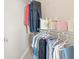 Walk-in closet features a variety of clothing, bags and accessories neatly arranged on racks at 325 E Paces Ferry Rd # 2003, Atlanta, GA 30305