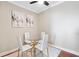 Cozy dining area features a glass table, modern chairs, and decorative artwork at 325 E Paces Ferry Rd # 2003, Atlanta, GA 30305