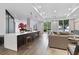 Open-concept kitchen and living room with breakfast bar and lots of natural light at 325 E Paces Ferry Rd # 2003, Atlanta, GA 30305