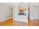 Open concept living room features wood floors and a view into the dining area and kitchen at 325 E Paces Ferry Rd # 2003, Atlanta, GA 30305