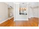 Bright open concept living room features wood floors and a view into the dining area and kitchen at 325 E Paces Ferry Rd # 2003, Atlanta, GA 30305