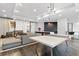 A spacious living room with comfortable seating, modern lighting, and a ping pong table at 325 E Paces Ferry Rd # 2003, Atlanta, GA 30305