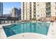 Beautiful in-ground pool with lounge chairs and city views, perfect for relaxation and entertaining at 325 E Paces Ferry Rd # 2003, Atlanta, GA 30305