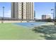Well-maintained tennis court provides an excellent recreational amenity for residents to enjoy sports and outdoor activities at 325 E Paces Ferry Rd # 2003, Atlanta, GA 30305