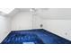 Bright attic with white walls, blue carpet and a ceiling fan at 5270 Forest Brook Pkwy, Marietta, GA 30068