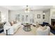 Open-concept living room featuring a fireplace, bright ambiance, and classic furniture at 5270 Forest Brook Pkwy, Marietta, GA 30068