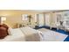 Bright main bedroom featuring hardwood floors, sitting area, and access to a private balcony at 5270 Forest Brook Pkwy, Marietta, GA 30068