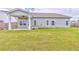 Lush backyard offers plenty of room for play and relaxation, enhanced by a covered patio at 101 Wins Walk, Cartersville, GA 30121