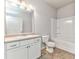 Clean bathroom with a single vanity, large mirror, and a shower-tub combo with white tiling at 101 Wins Walk, Cartersville, GA 30121