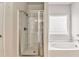 Bathroom featuring a glass-enclosed shower and a separate soaking tub at 101 Wins Walk, Cartersville, GA 30121