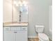 Clean bathroom with a single vanity, large mirror, and a shower-tub combo with white tiling at 101 Wins Walk, Cartersville, GA 30121