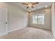 Spacious bedroom with plush carpeting, a ceiling fan, and a bright window for natural light and a view at 101 Wins Walk, Cartersville, GA 30121