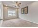 Bright bedroom with a ceiling fan, recessed lights, neutral paint and a large window with neighborhood view at 101 Wins Walk, Cartersville, GA 30121