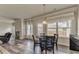 Dining area with views of fireplace, backyard through a large window and open to the living room and kitchen at 101 Wins Walk, Cartersville, GA 30121