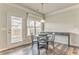 Bright dining area with hardwood floors, chandelier, and access to the backyard, perfect for casual meals at 101 Wins Walk, Cartersville, GA 30121