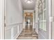 Open entryway with wood-look flooring, wainscoting, and a view into the home at 101 Wins Walk, Cartersville, GA 30121