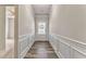 Inviting foyer featuring stylish wood floors, detailed wainscoting, and natural light at 101 Wins Walk, Cartersville, GA 30121