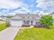 Inviting home with great curb appeal, featuring a lush green lawn and colorful landscaping at 101 Wins Walk, Cartersville, GA 30121