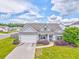 Charming single-story home with beautiful landscaping, including flowering bushes, a well-maintained lawn and two-car garage at 101 Wins Walk, Cartersville, GA 30121