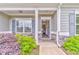 Welcoming front porch with stone details, decorative wreath, and a view into the home's entryway at 101 Wins Walk, Cartersville, GA 30121
