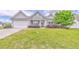 Well-maintained front yard with vibrant plantings and a freshly paved driveway, enhancing its appeal at 101 Wins Walk, Cartersville, GA 30121
